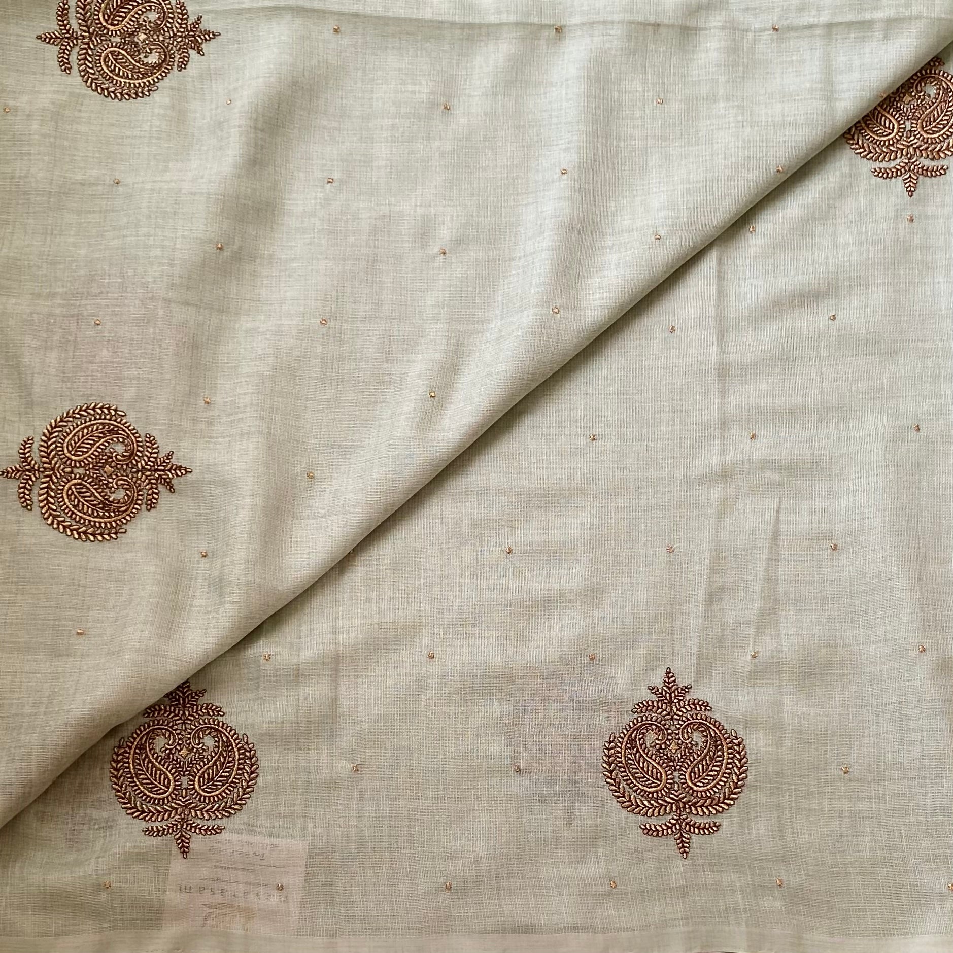 Sage Green Embroidered Saree with Copper Motifs and Tassels Elegant