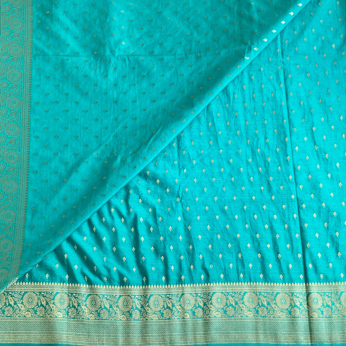 Turquoise Soft Crepe Silk Saree With Metallic Gold Brocade Border And Pallu