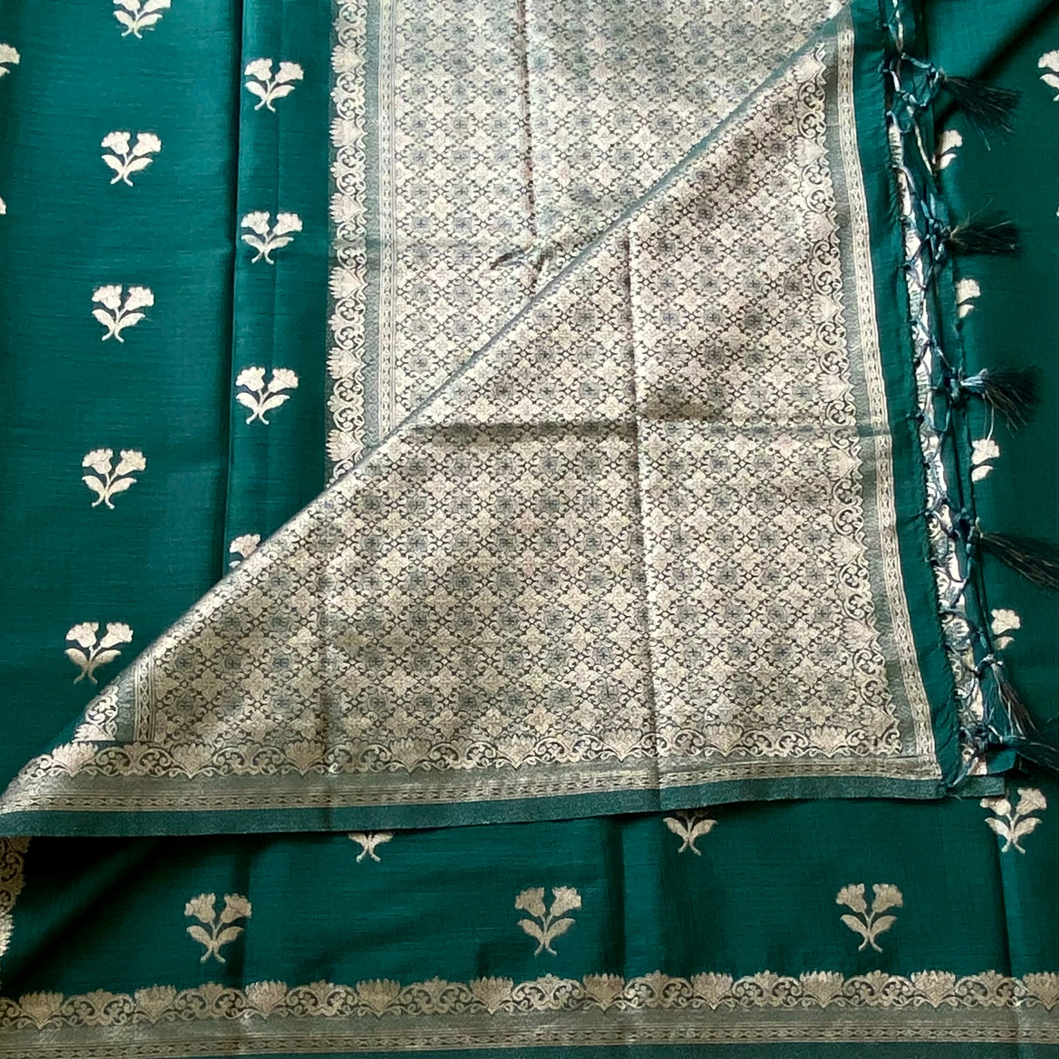 Emerald Green soft tussar with antique silver buttas and lotus borders