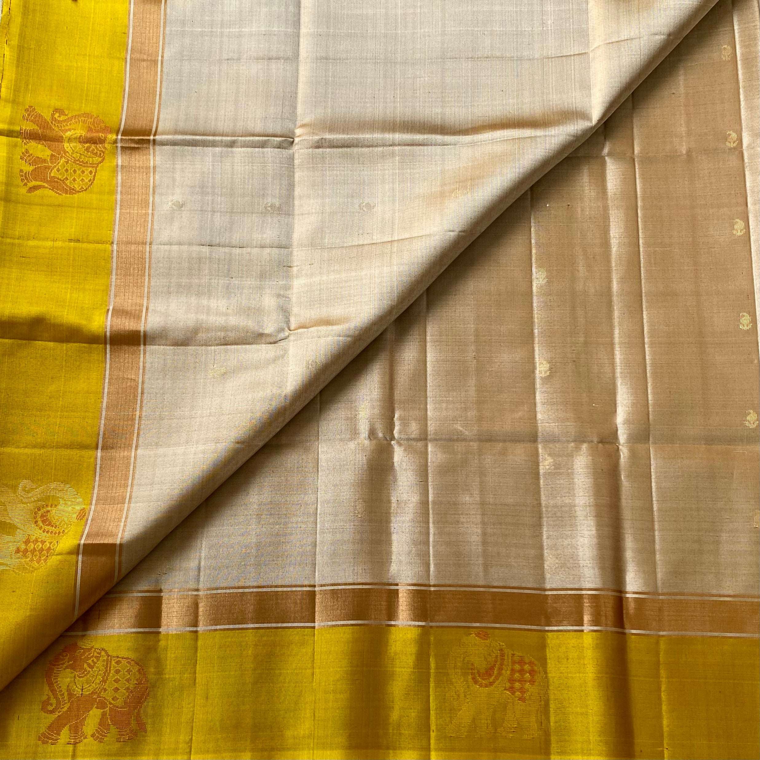 Shades of Beige • mango yellow on Designer pure silk that comes with elephant borders