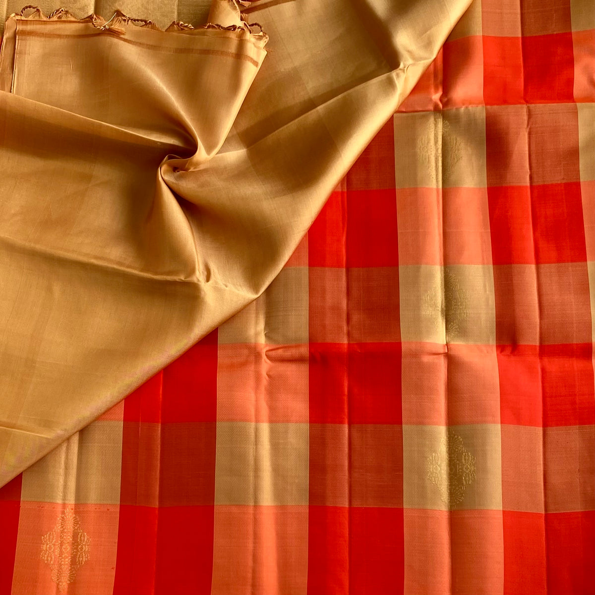 Vibrant Shades Of Orange Designer Pure Silk Saree With Golden Beige Checks