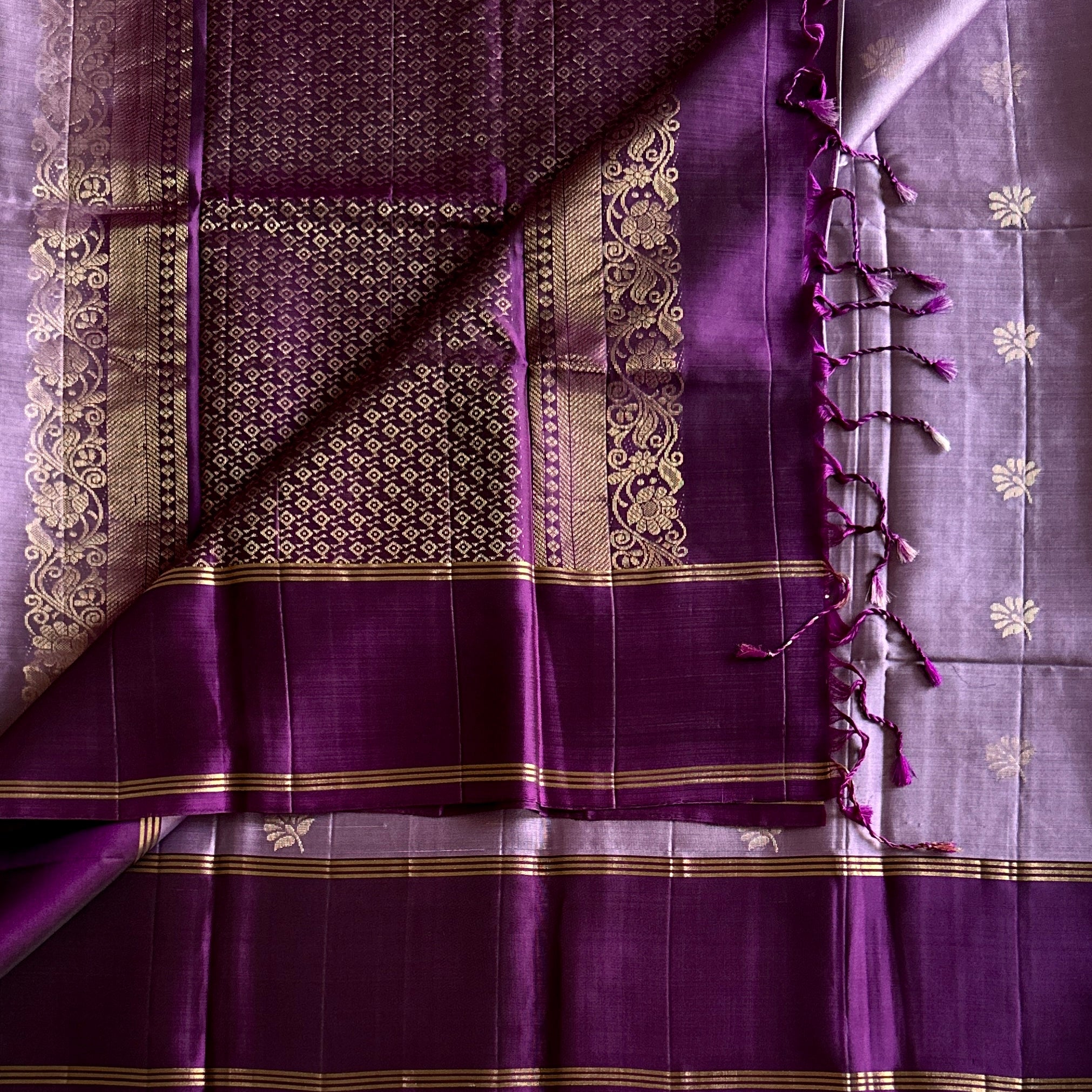 Purple silk saree gold zari floral border diamond pallu tassels