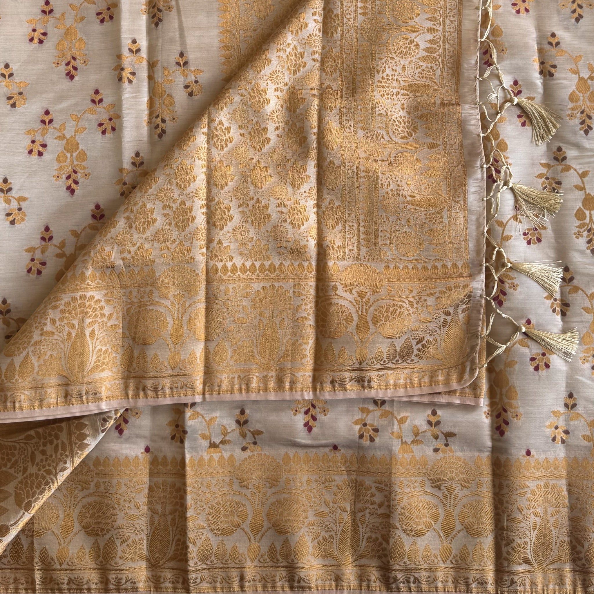 Ivory Gold Woven Silk Saree With Broad Floral Border Tassels