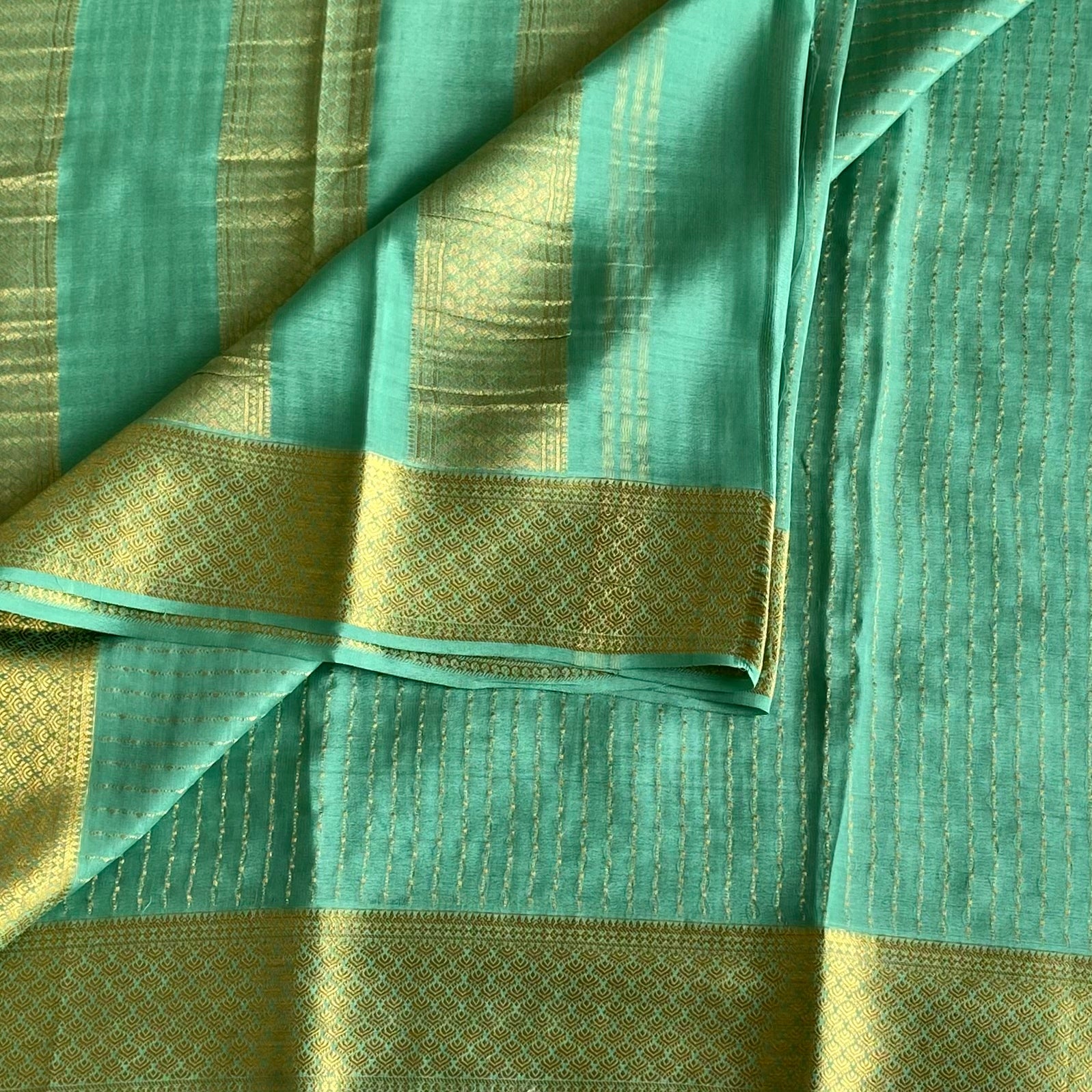 Dreamy Sea Blue Mysore Crepe Silk Saree With Metallic Gold Border