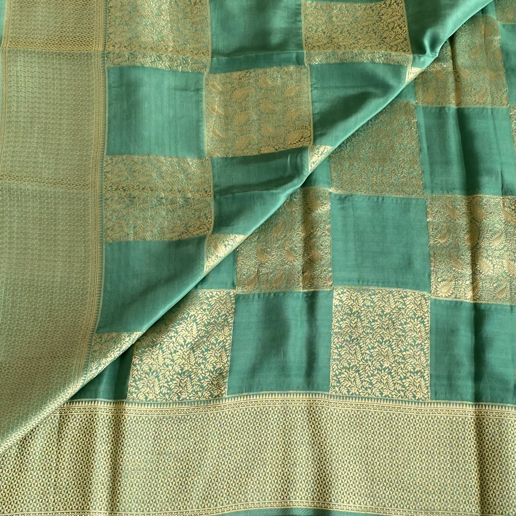 Teal Green Soft Premium Crepe Silk Saree With Gold Zari Checked Panels
