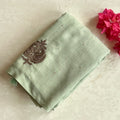 Sage Green Embroidered Saree with Copper Motifs and Tassels Elegant