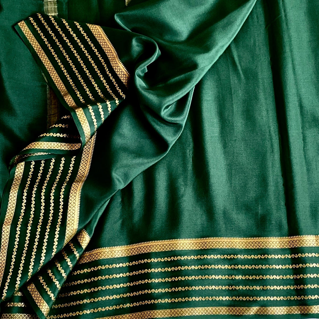 Deep Teal Saree with Gold Zari Stripes and Patterned Border