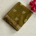 Olive Green soft tussar with antique silver buttas and lotus borders