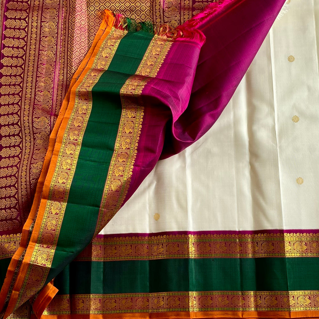 Classy Pearl White With Emerald Green Pure Zari Kanjeevaram Stunner