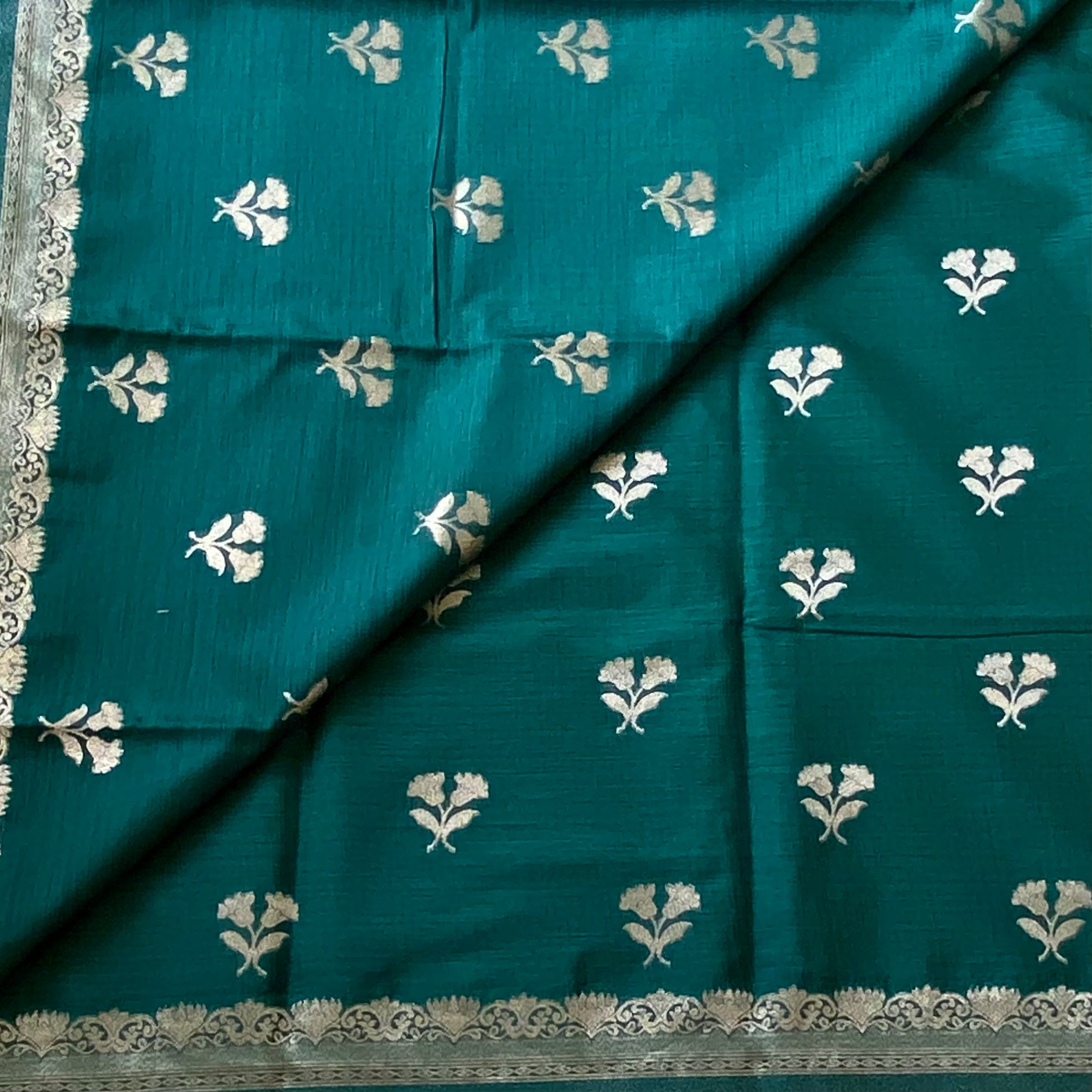 Emerald Green soft tussar with antique silver buttas and lotus borders