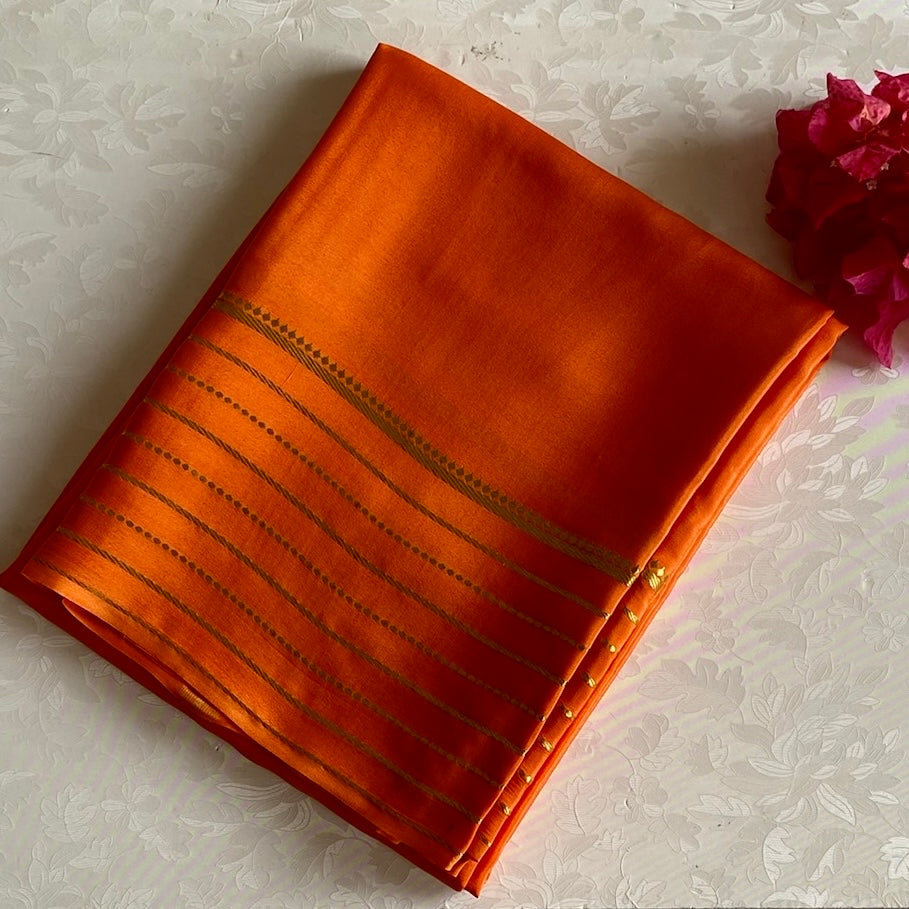 Sunset Orange Mysore Crepe Silk Saree With Metallic Gold Stripes