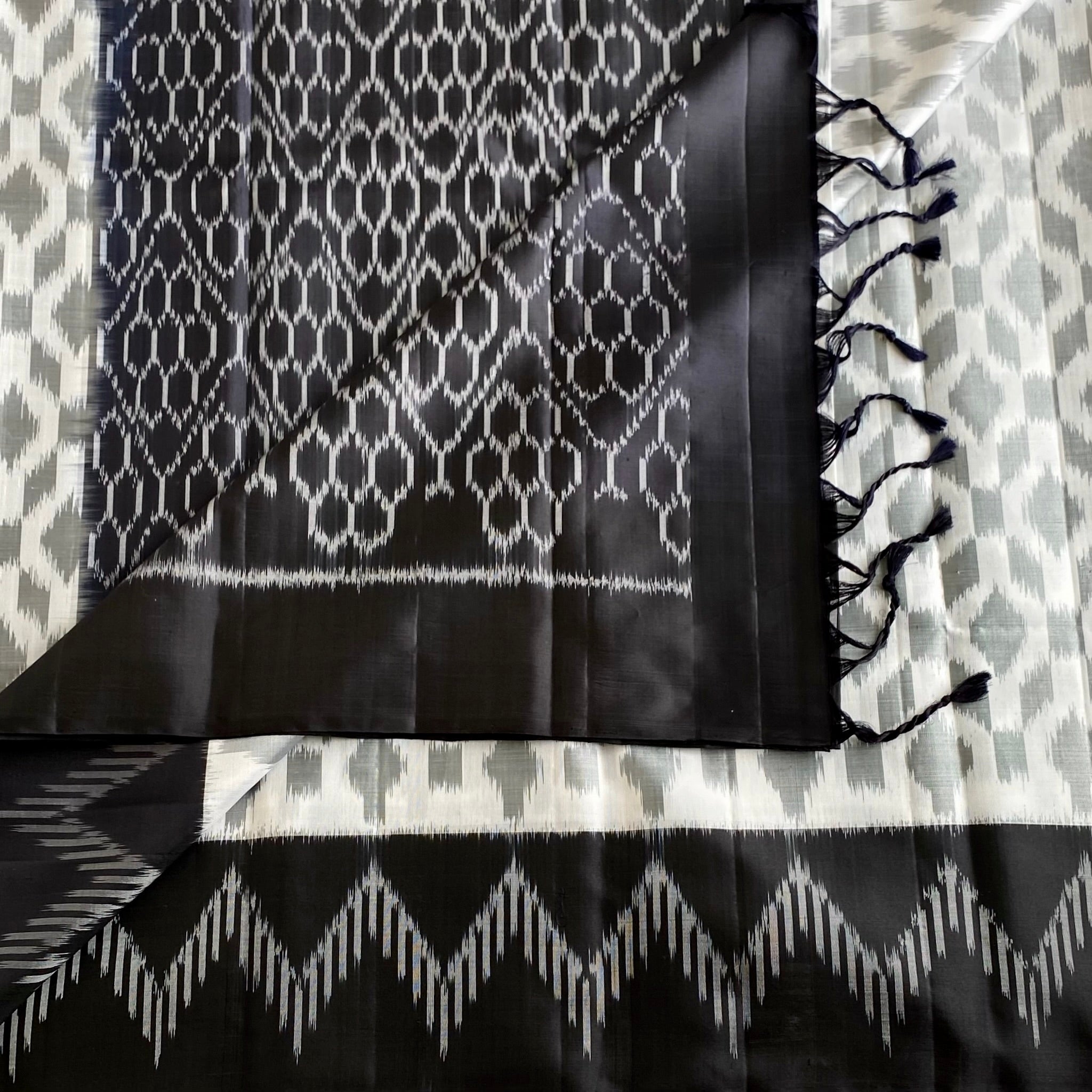 Pearl White And Black Designer Pure Silk Saree With Silver Gray Ikat Border