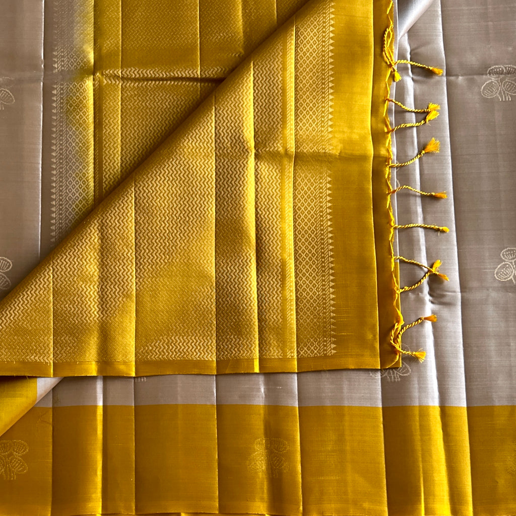 Mustard Yellow Silk Saree with Silver Zari Pallu Floral Motifs