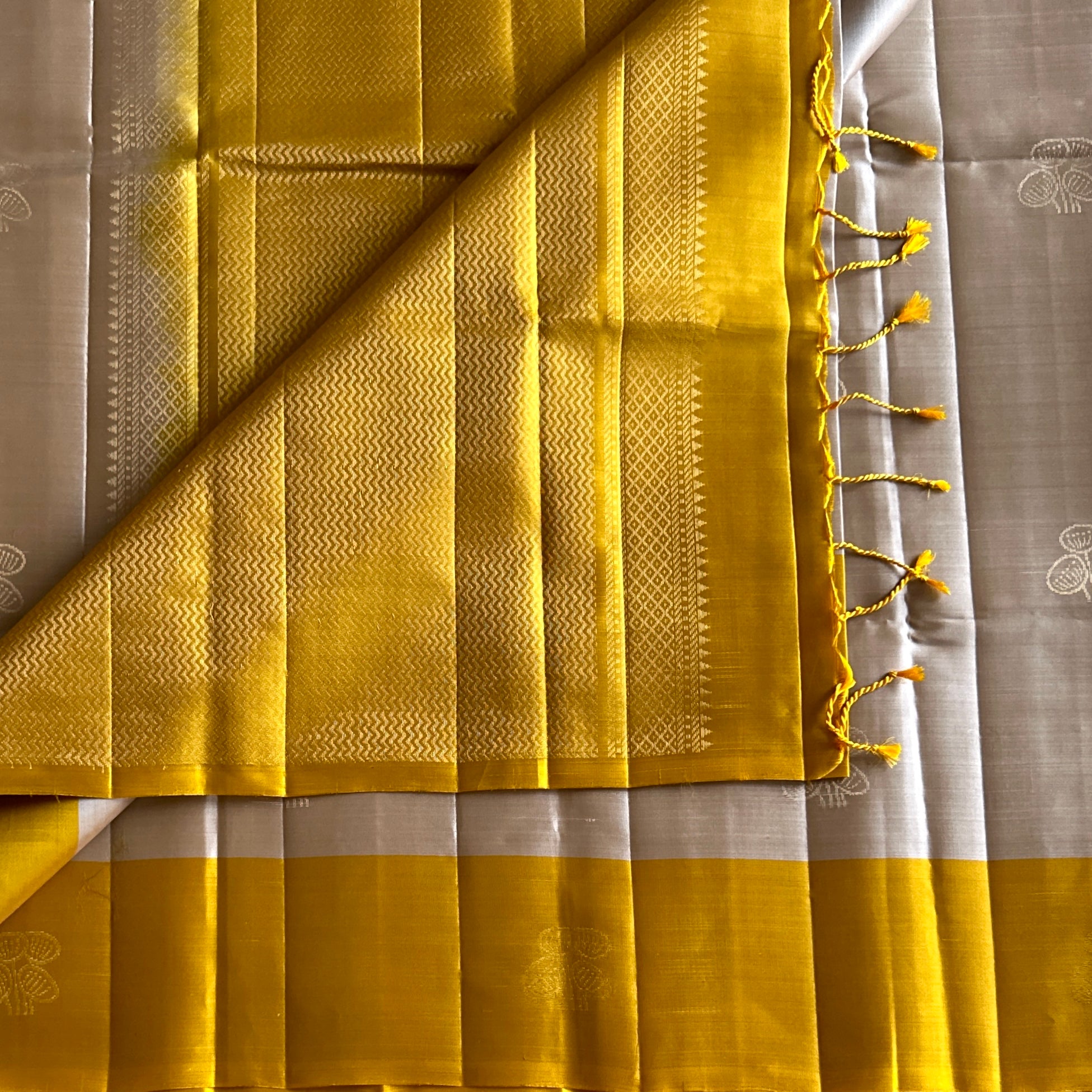 Mustard Yellow Silk Saree with Silver Zari Pallu Floral Motifs