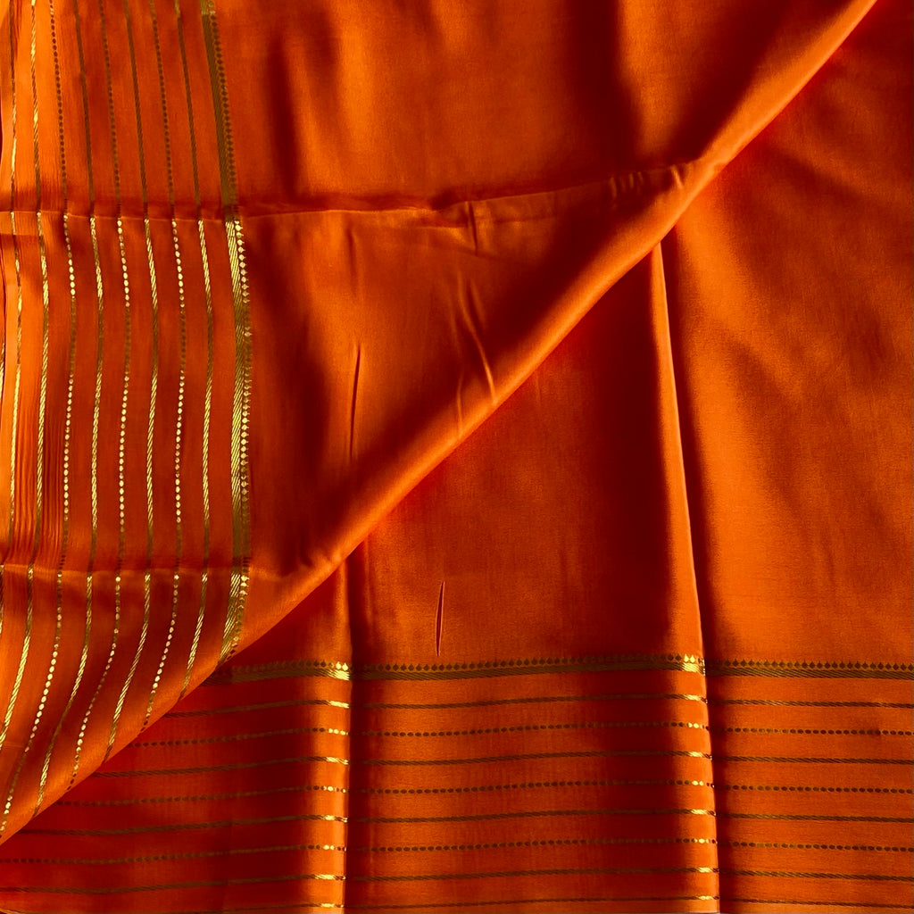 Sunset Orange Mysore Crepe Silk Saree With Metallic Gold Stripes