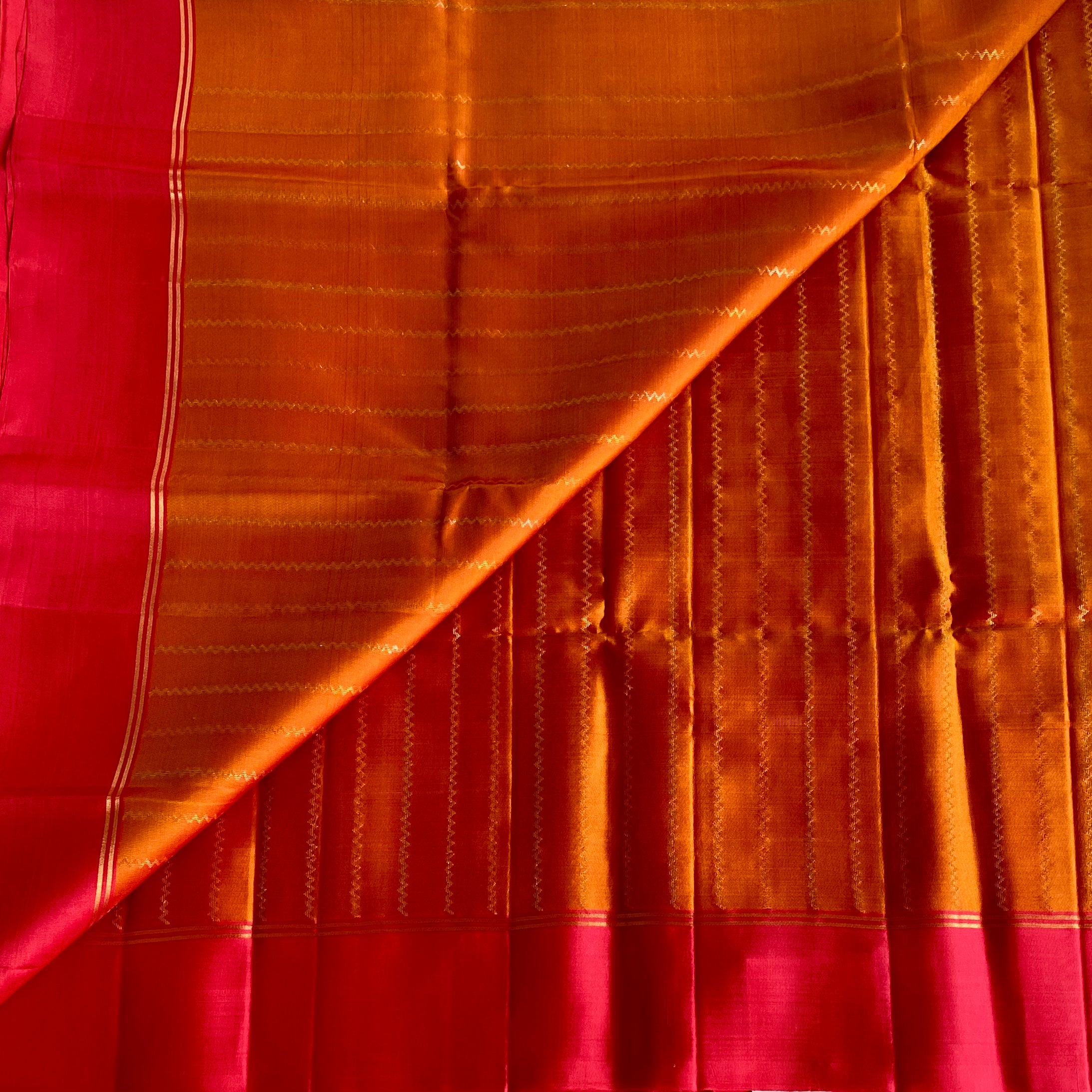 Saffron Orange Designer Pure Silk Saree With Rani Pink Pallu Gold Border