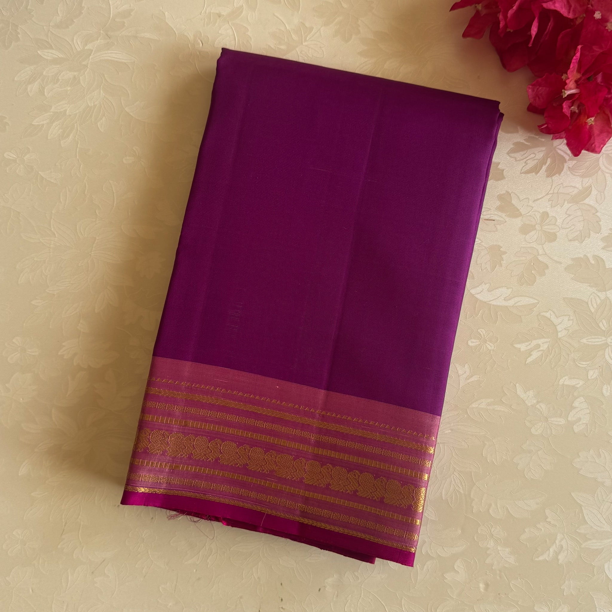 Traditional Magenta Gold Woven Saree With Floral Border And Tassels