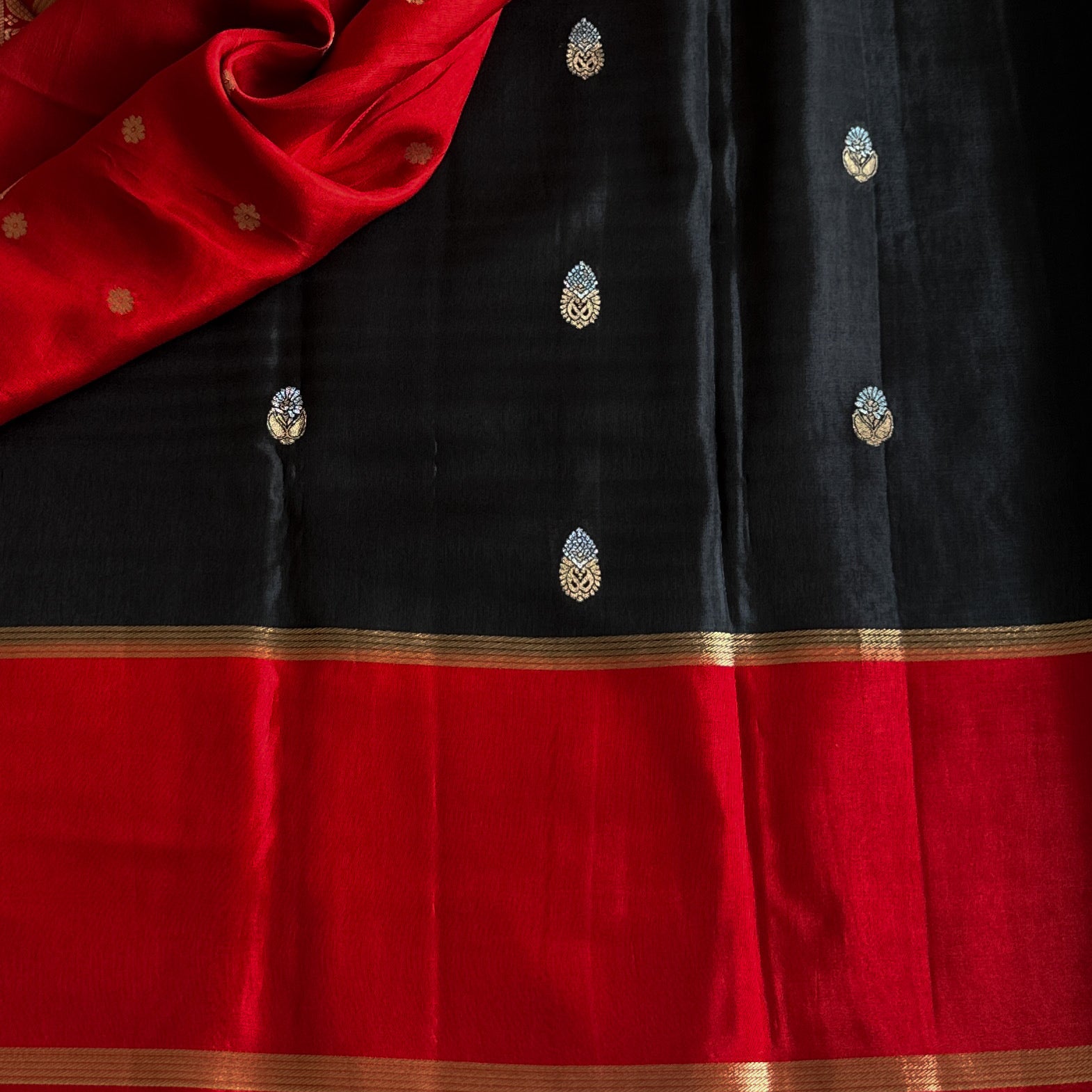 Black with exotic red jute tussar with antique designer zari weave