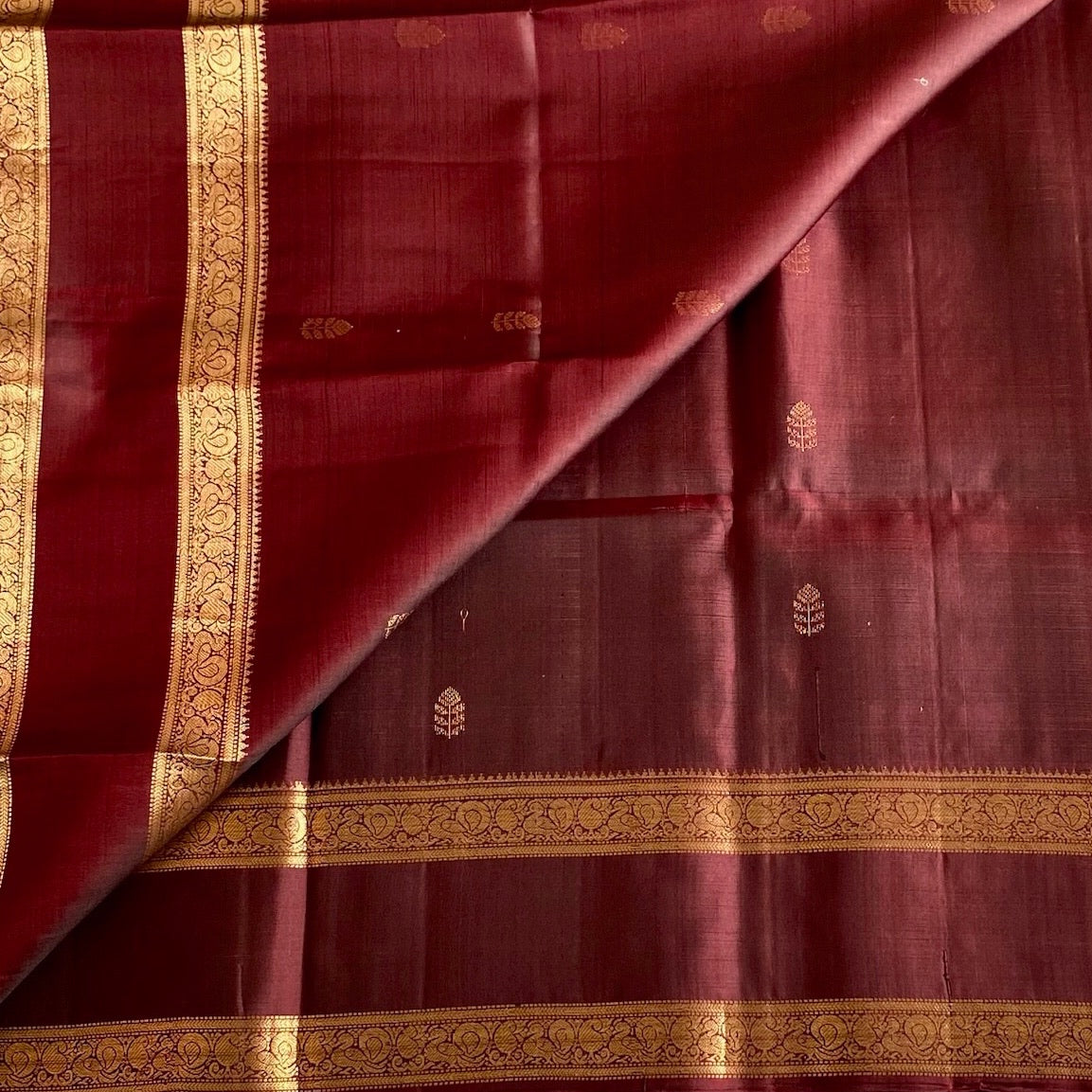 Burgundy Designer Pure Silk Saree With Gold Zari Borders And Paisley