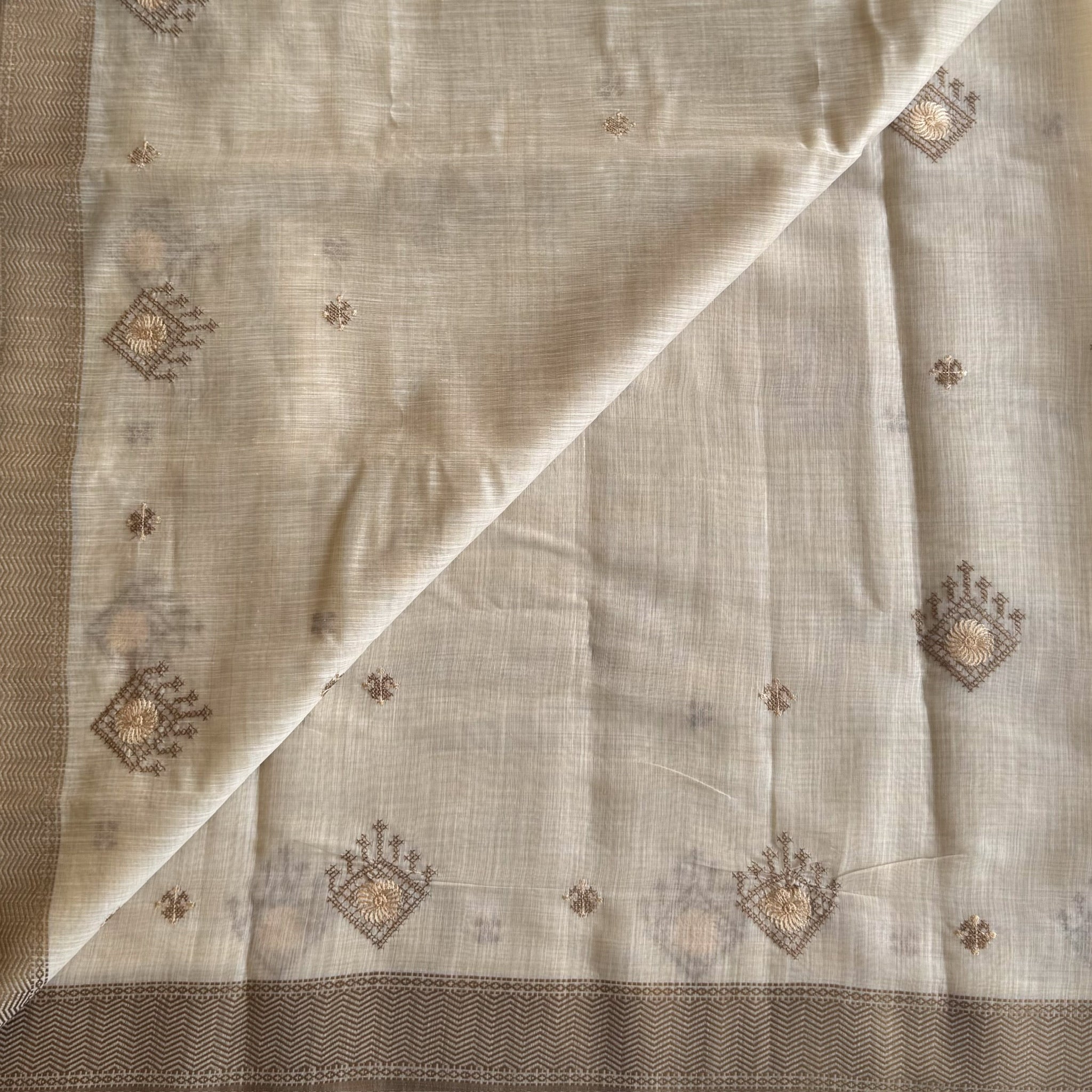 Ivory chestnut geometric handloom saree with woven zigzag border tassels