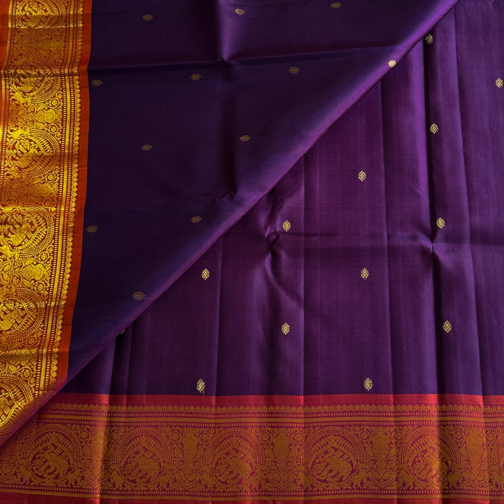 Elegant purple with dual shaded rust orange Kanjeevaram stunner