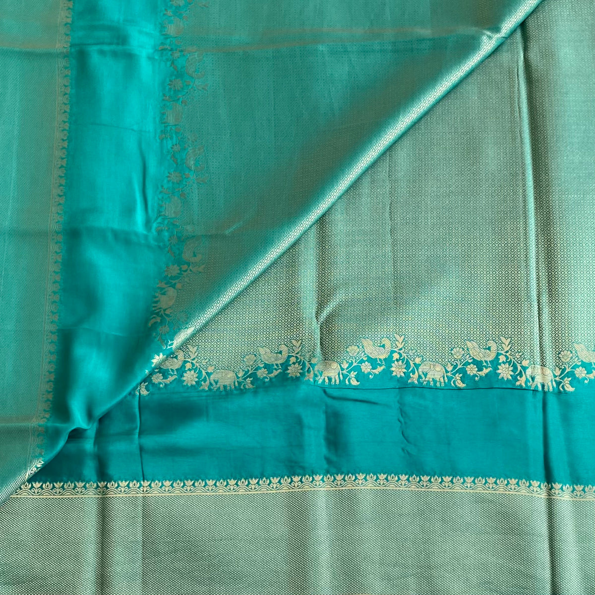 Teal Blue Soft Crepe Silk Saree With Navy Blue Border