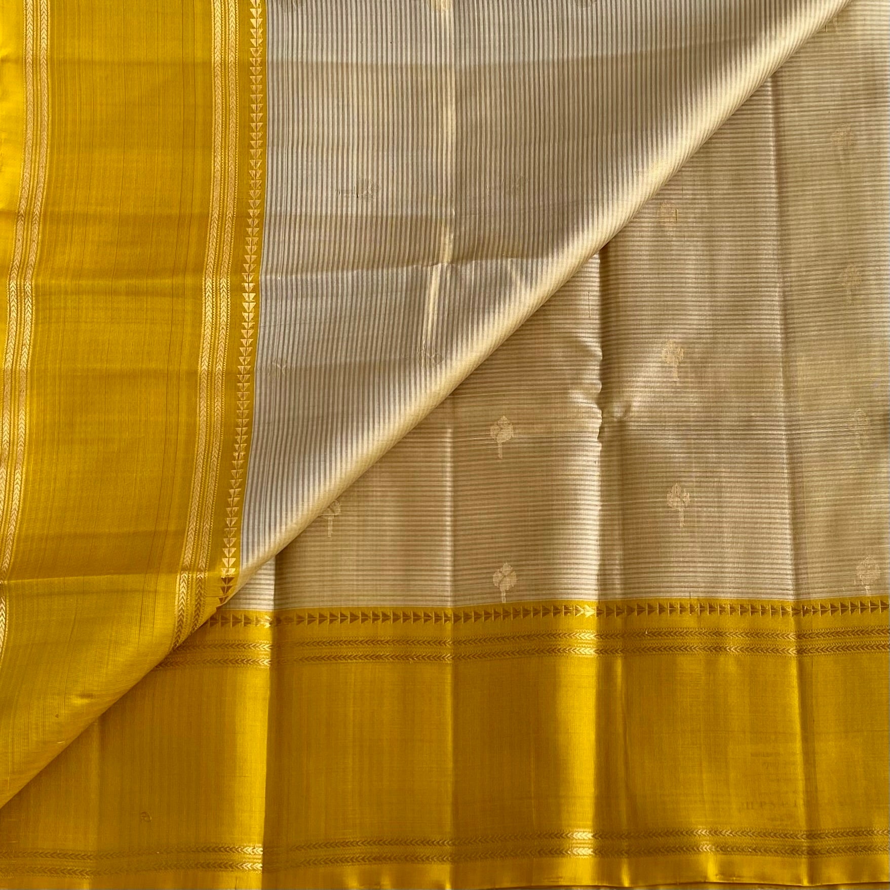 Silvery beige designer pure silk saree with mustard yellow pallu