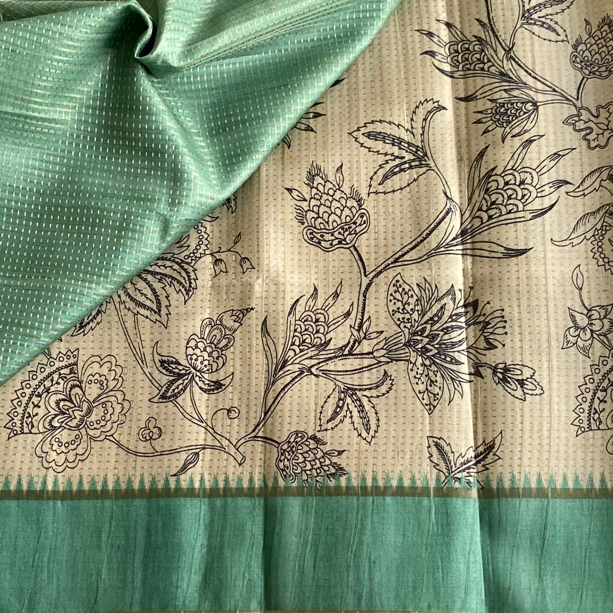 Beige Soft Tussar Silk Saree With pastel Teal Green Pallu And Gold Border