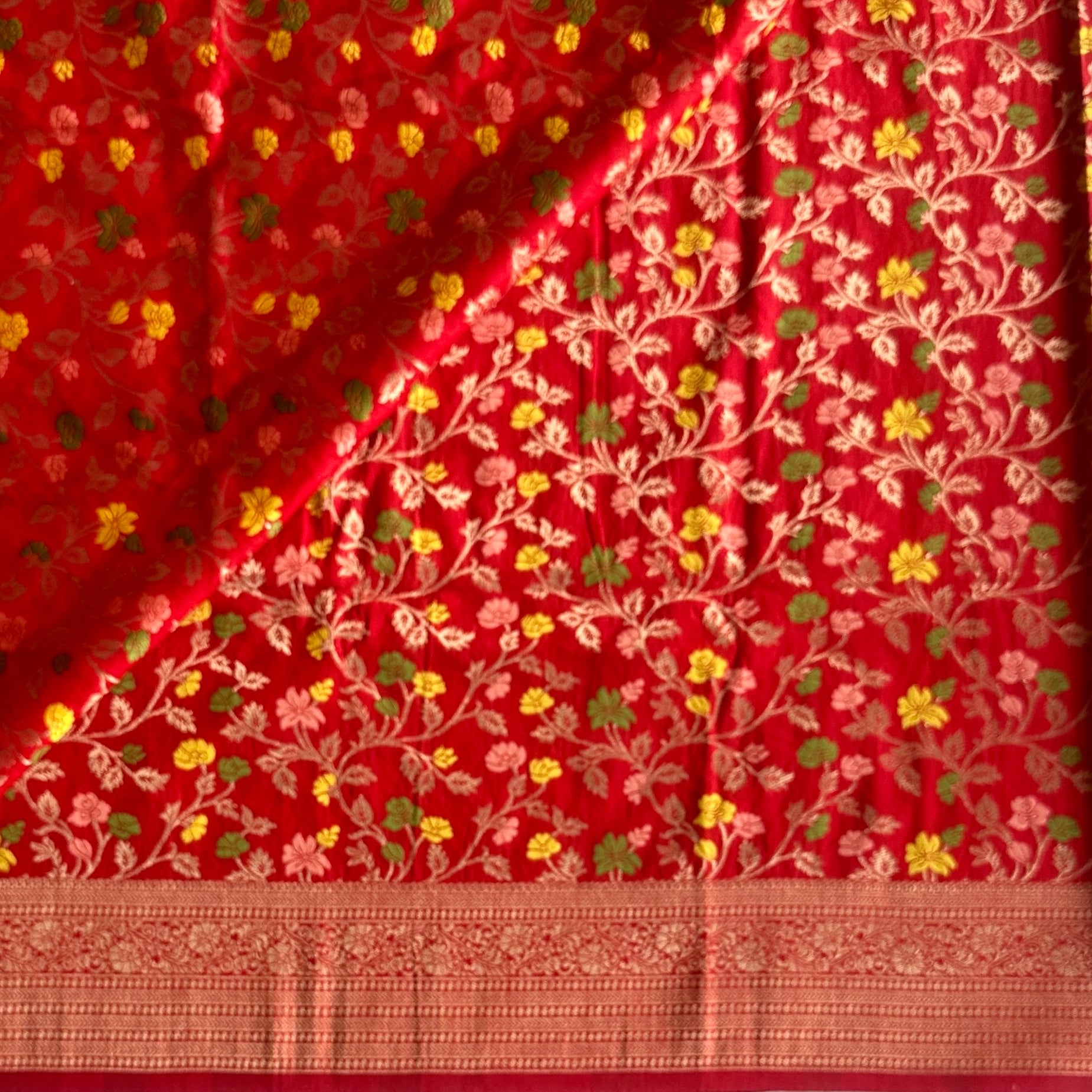 Lustrous Red Meenakari woven tussar with floral weave all over