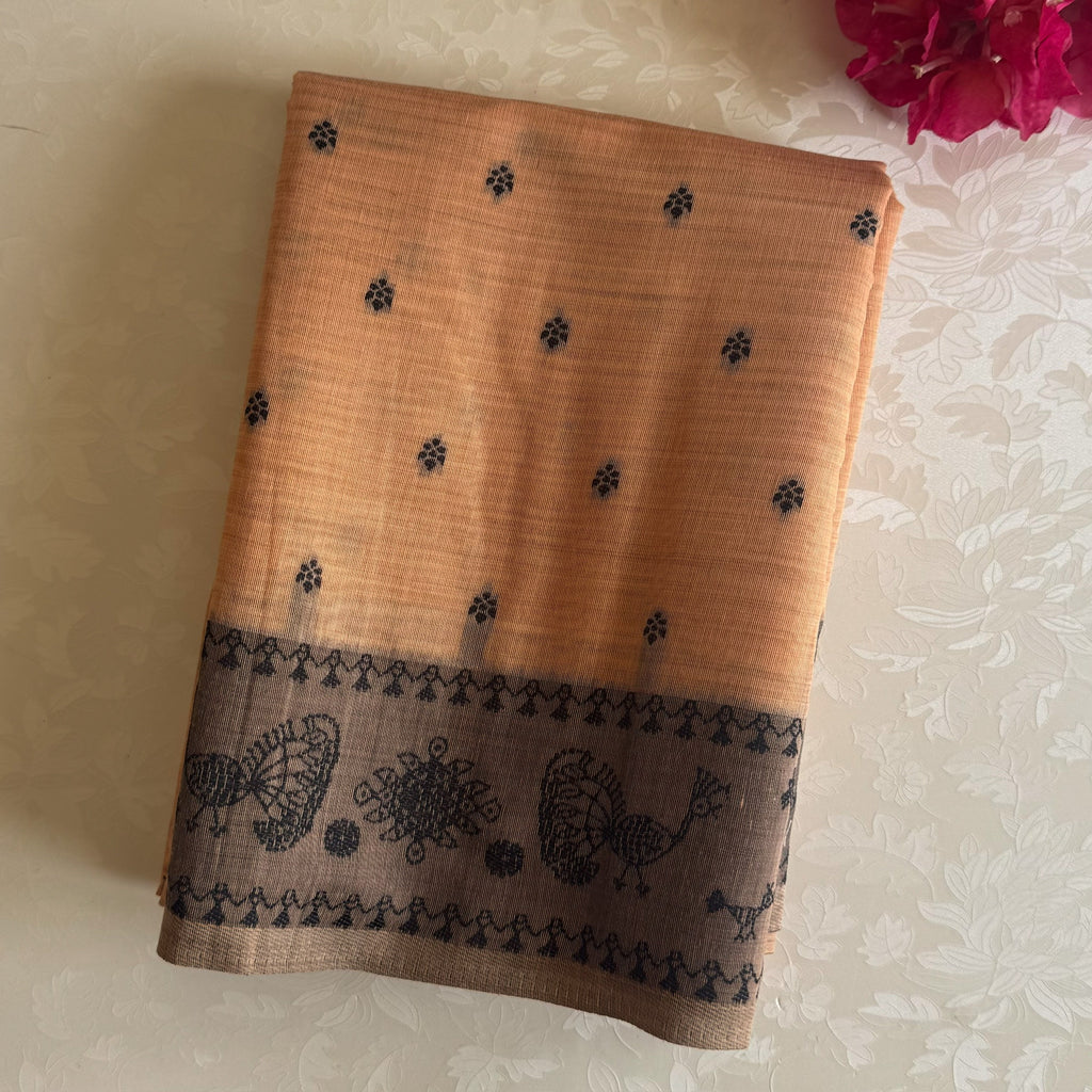 Elegant Muted Apricot Printed Tribal Pallu Saree With Tassel Border