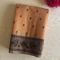 Elegant Muted Apricot Printed Tribal Pallu Saree With Tassel Border