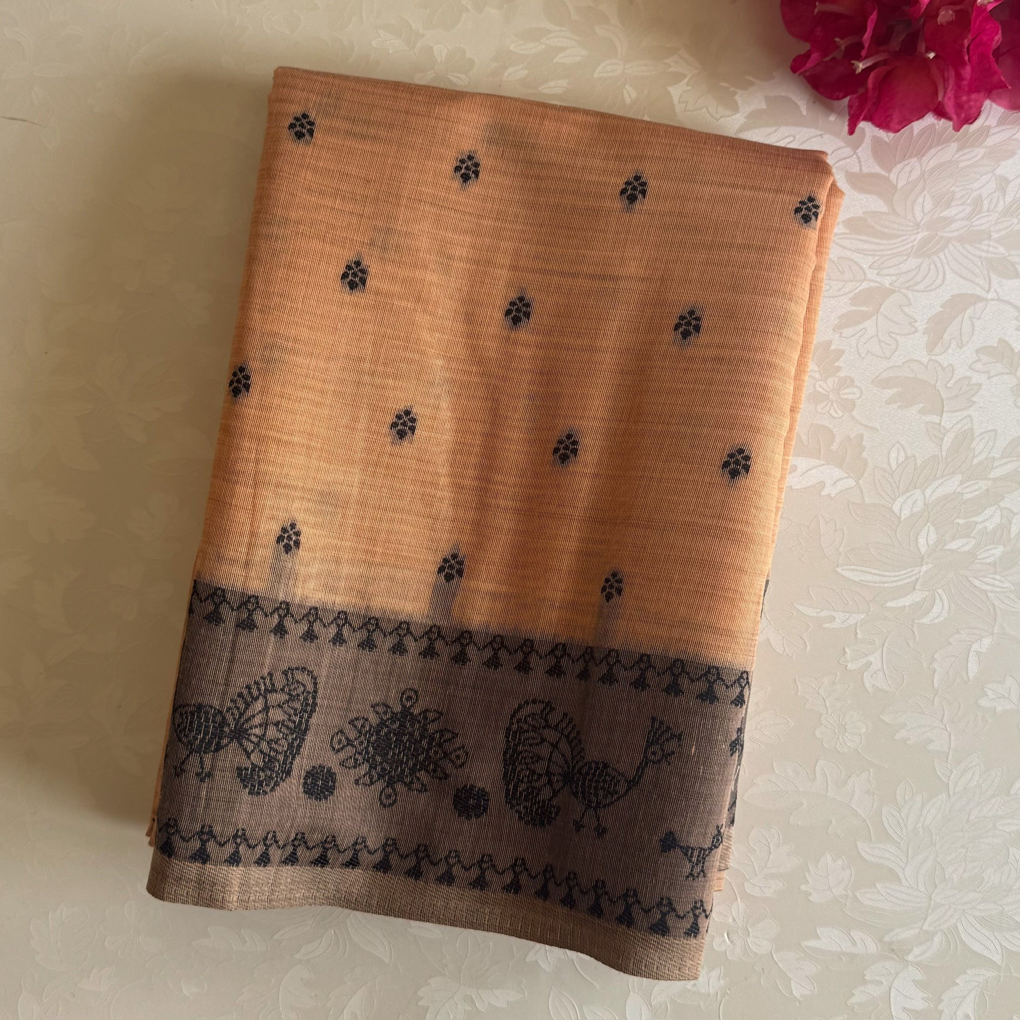 Elegant Muted Apricot Printed Tribal Pallu Saree With Tassel Border