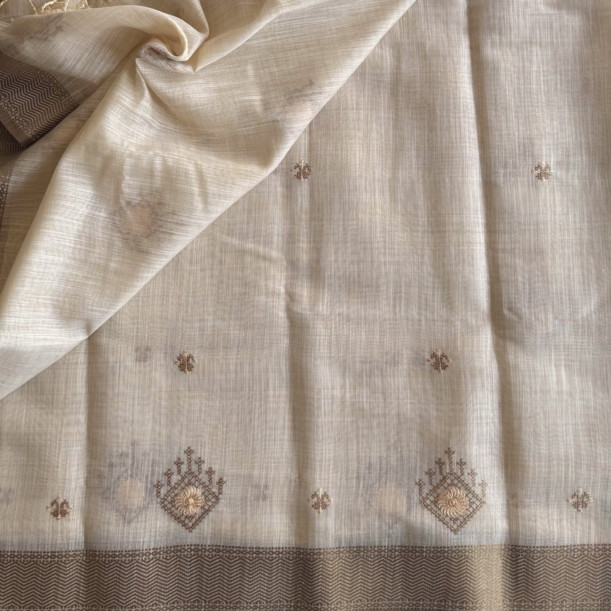 Ivory chestnut geometric handloom saree with woven zigzag border tassels