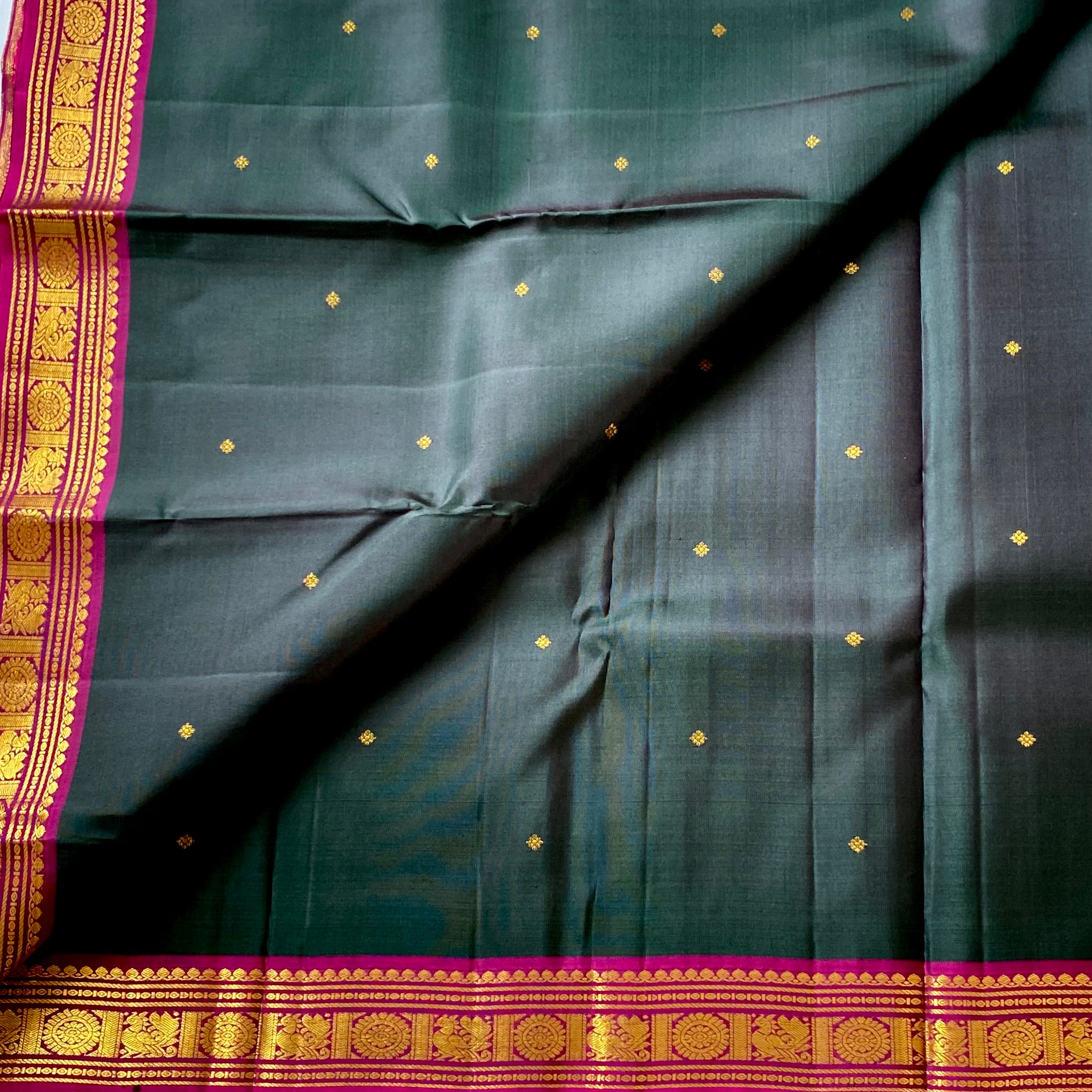 Traditional elegance Dual shaded the bottle green with magenta Kanjeevaram silk