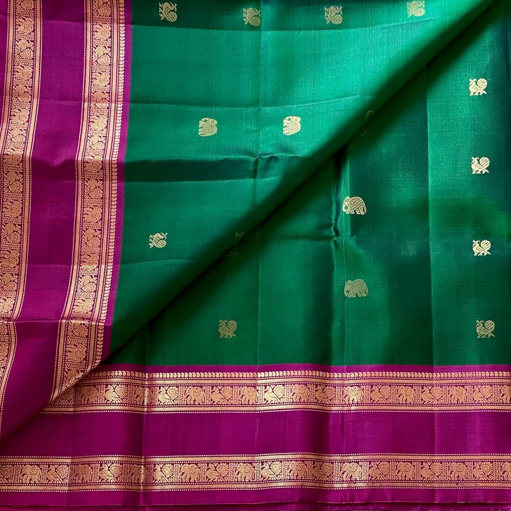 Rich Emarald Green Designer Pure Silk with Dreamy Magenta Contrast Pallu Elephant Buttas