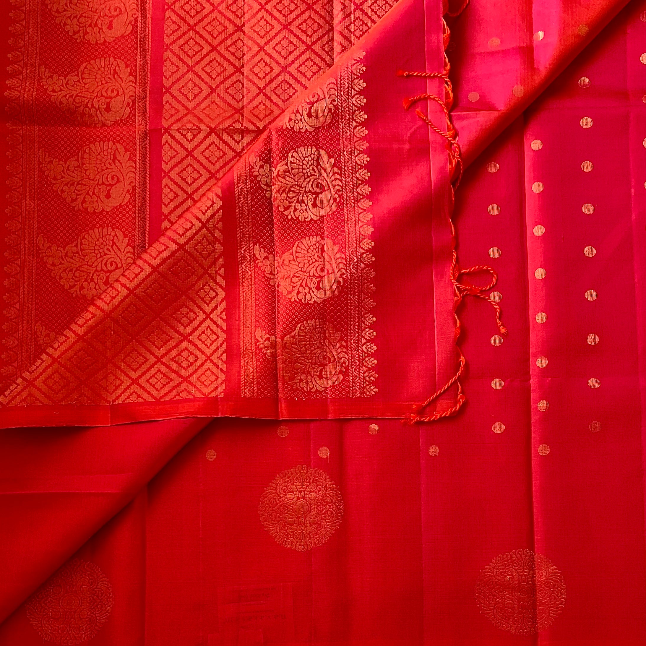 Kanakambari pinkish red Silk Saree Gold Medallion Paisley Pallu Tasseled End