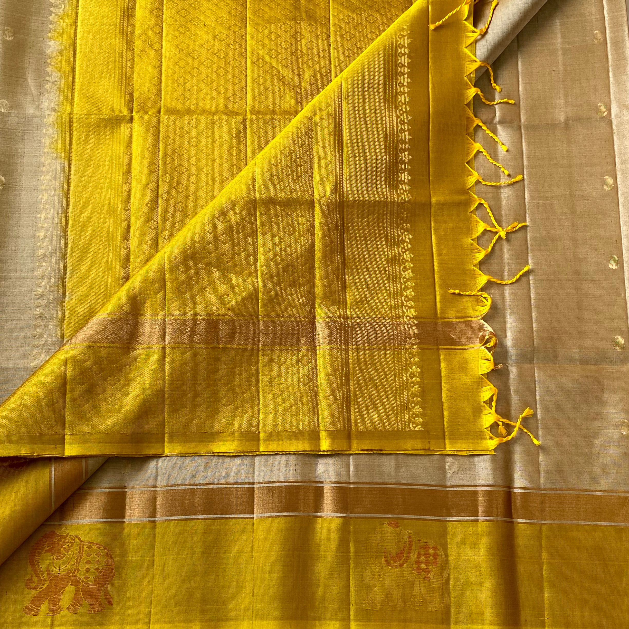 Shades of Beige • mango yellow on Designer pure silk that comes with elephant borders