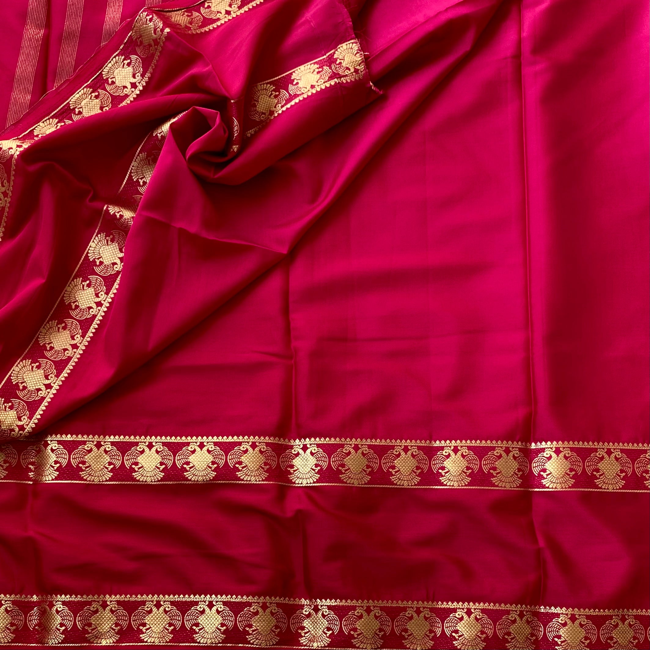 Magenta Silk Saree Gold Zari Stripes Floral Border Festive Wear
