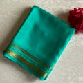 Magical Sea Green Mysore Crepe Silk Saree With Metallic Gold Border