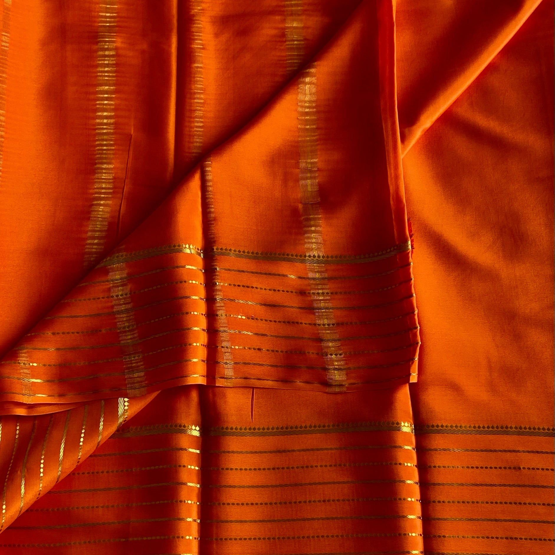 Sunset Orange Mysore Crepe Silk Saree With Metallic Gold Stripes