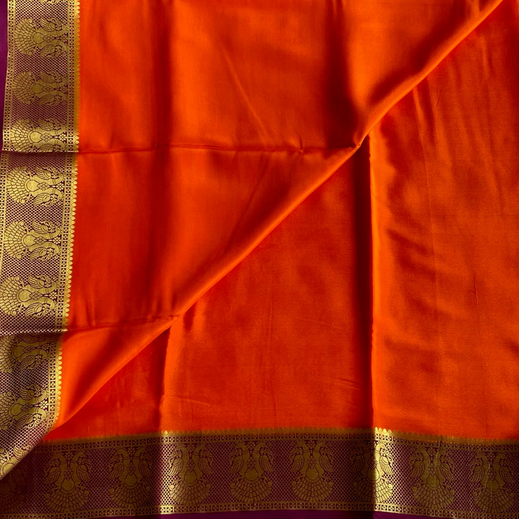 Vibrant Orange Saree Gold Peacock Border Deep Wine Purple Pallu Traditional