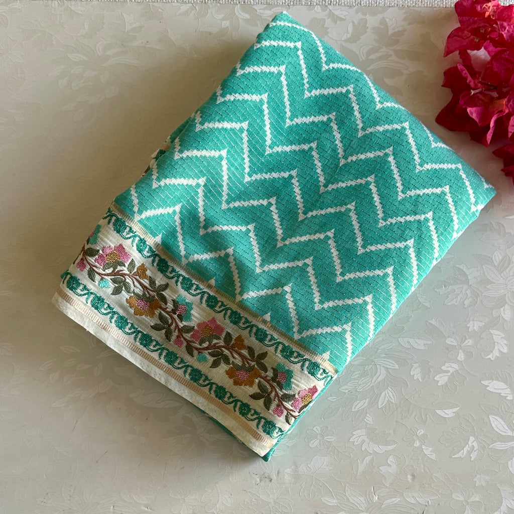 Turquoise Soft Tussar Silk Saree With Cream Floral Border
