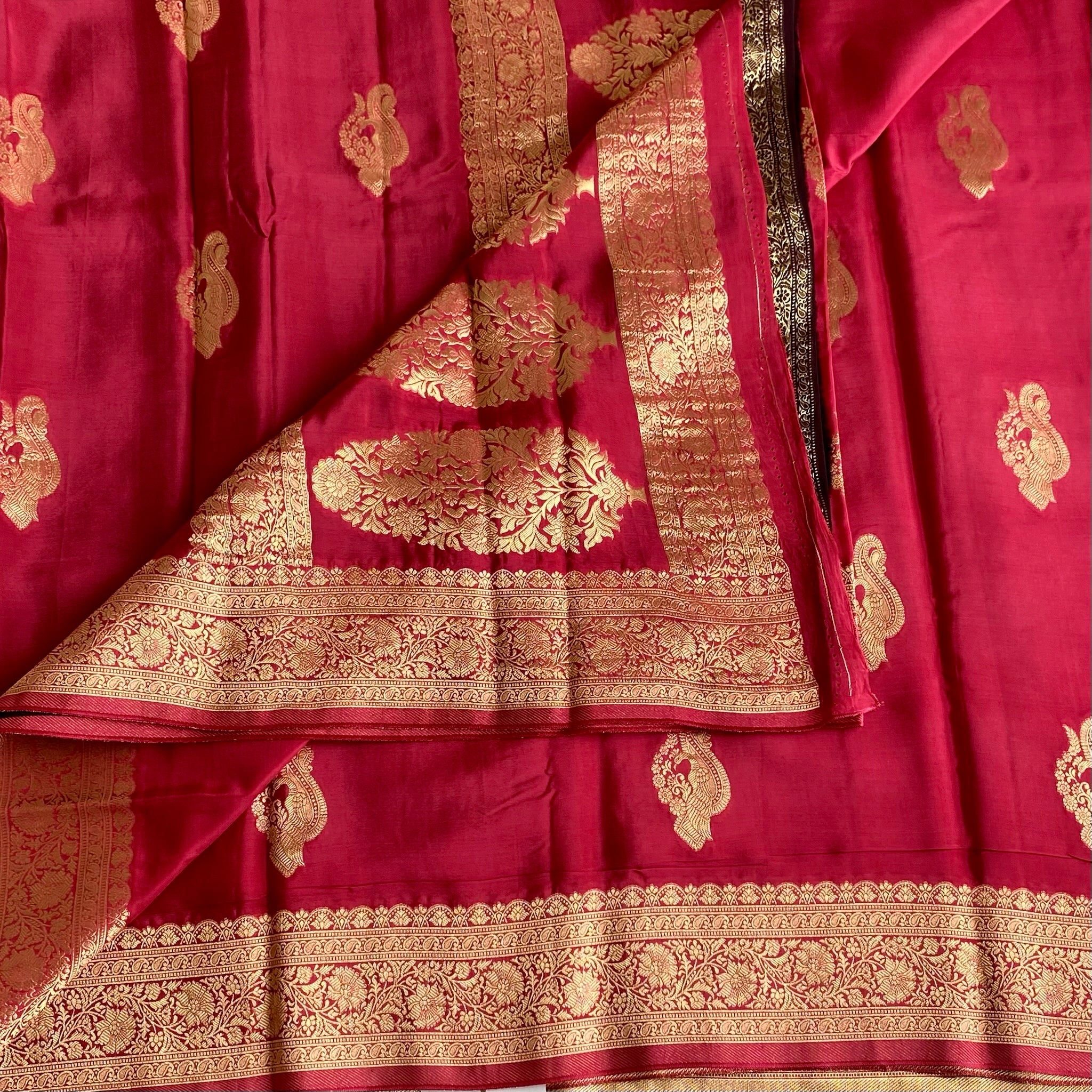 Peachish Pink Soft Crepe Silk Saree With Gold Zari Border & Wine Blouse