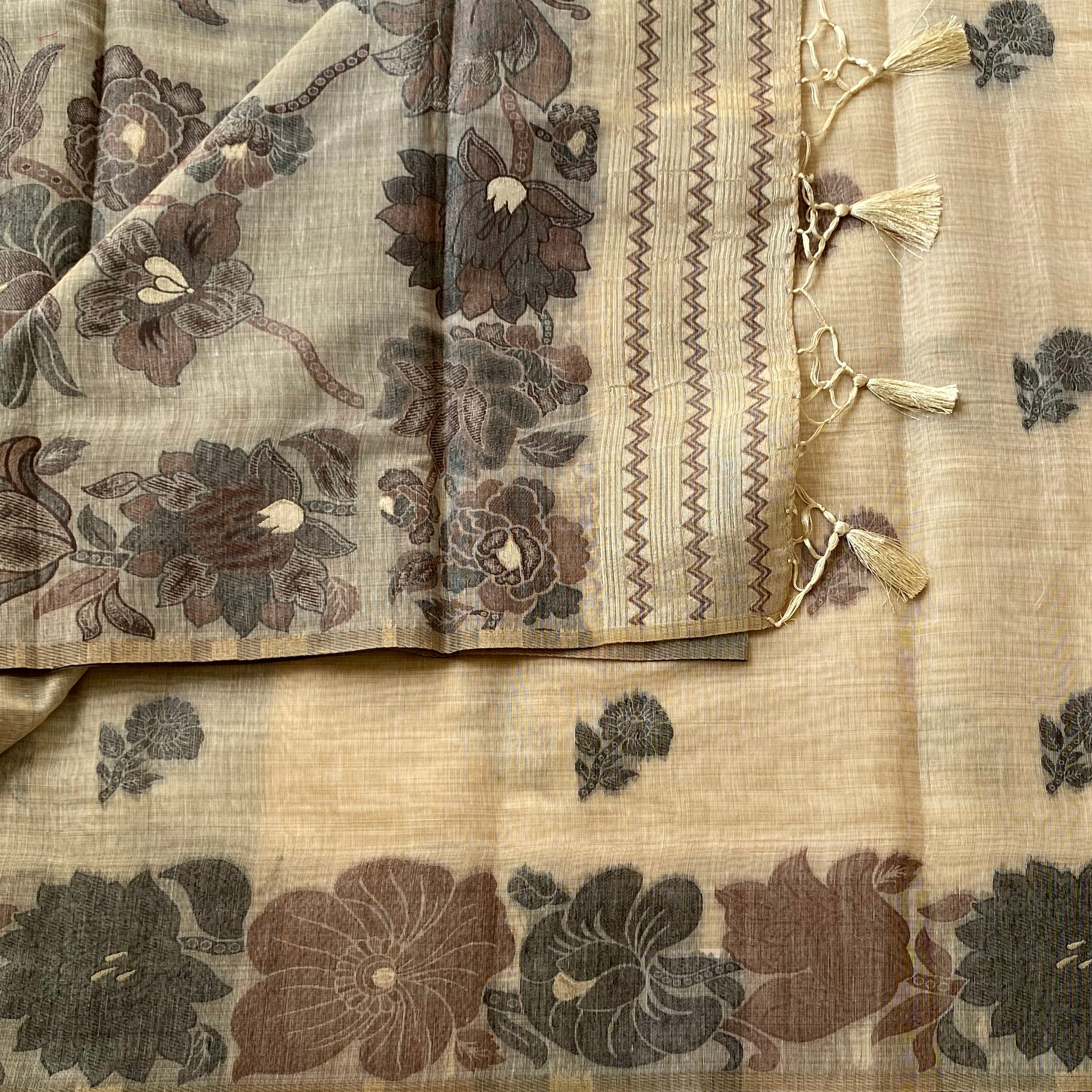 Muted Floral Linen Saree With Tassel Border Elegant Neutral Drapes