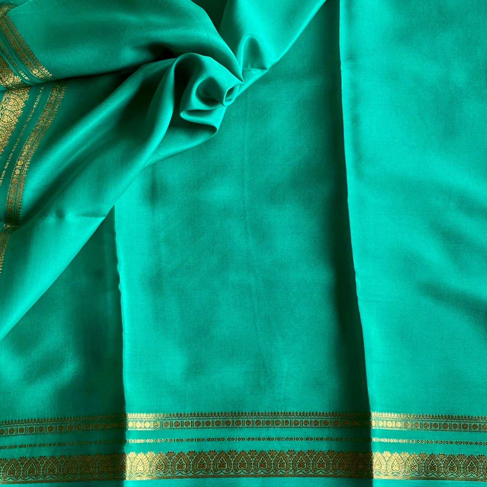Magical Sea Green Mysore Crepe Silk Saree With Metallic Gold Border