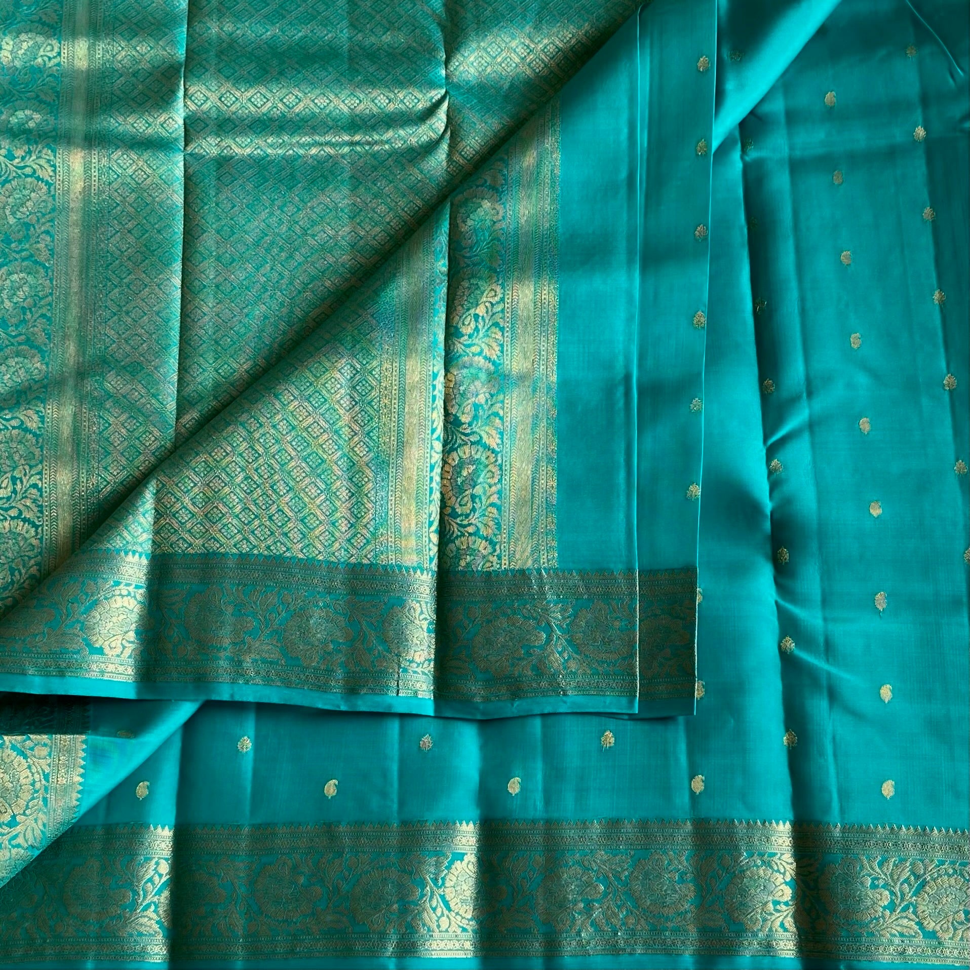 Dreamy Sea Blue And Gold Designer Pure Silk Saree With Floral Zari Border