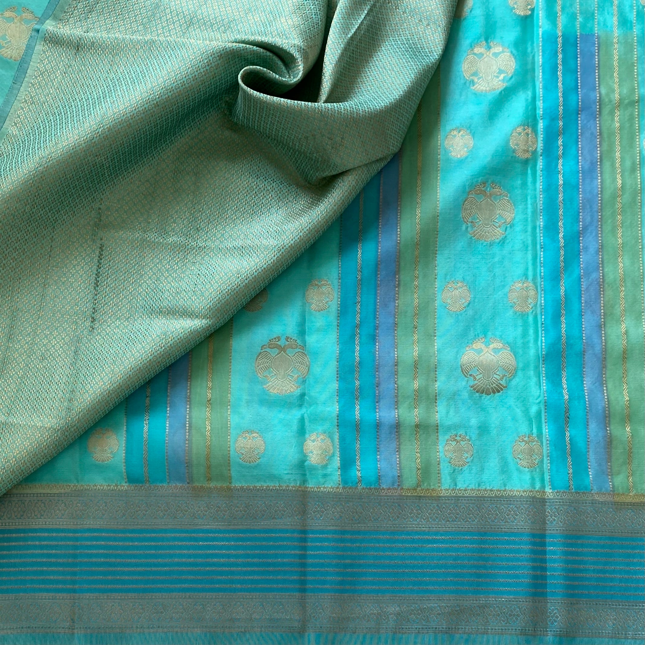 Shades Of Sea Blue On Soft Crepe Silk With Gandaberunda Buttas