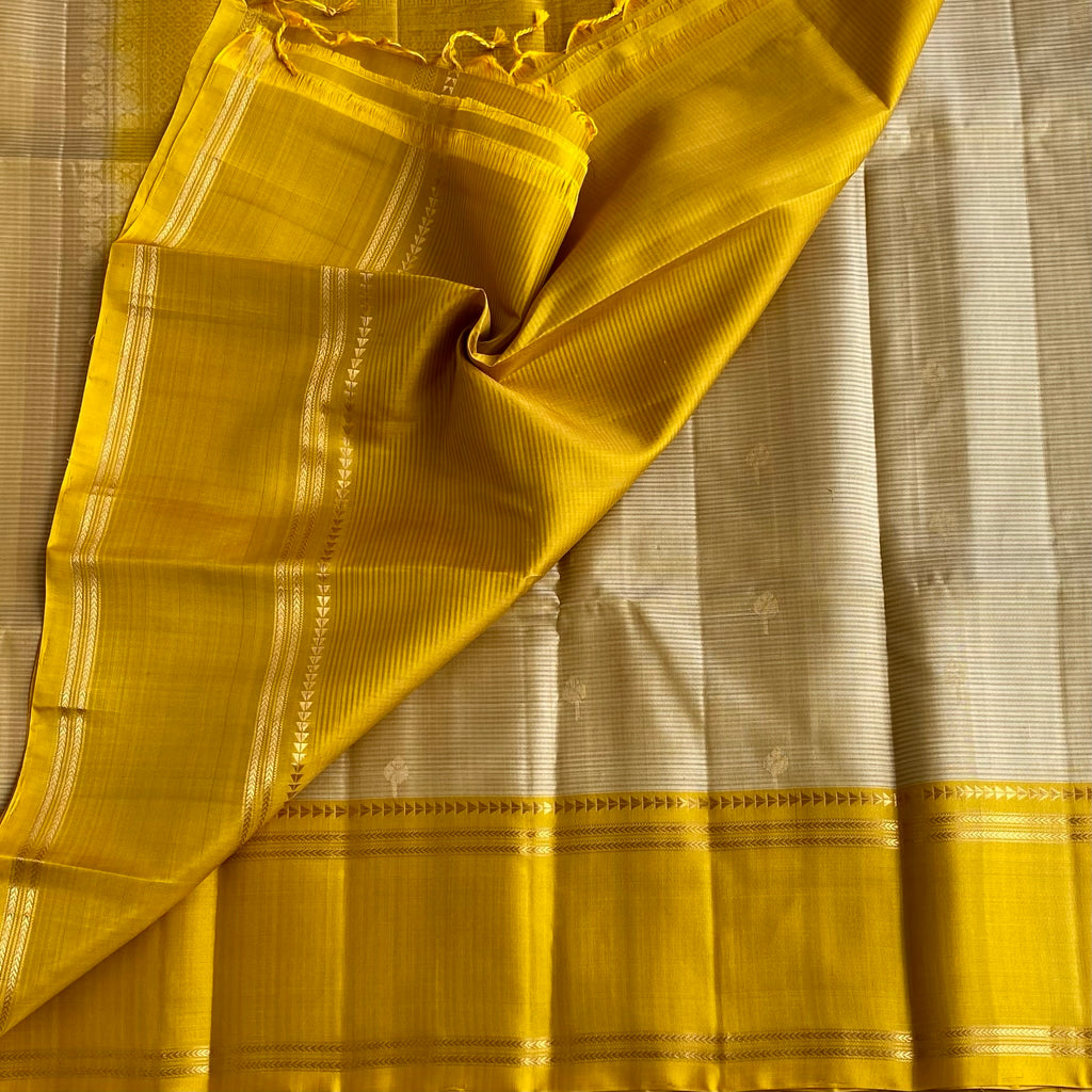 Silvery beige designer pure silk saree with mustard yellow pallu