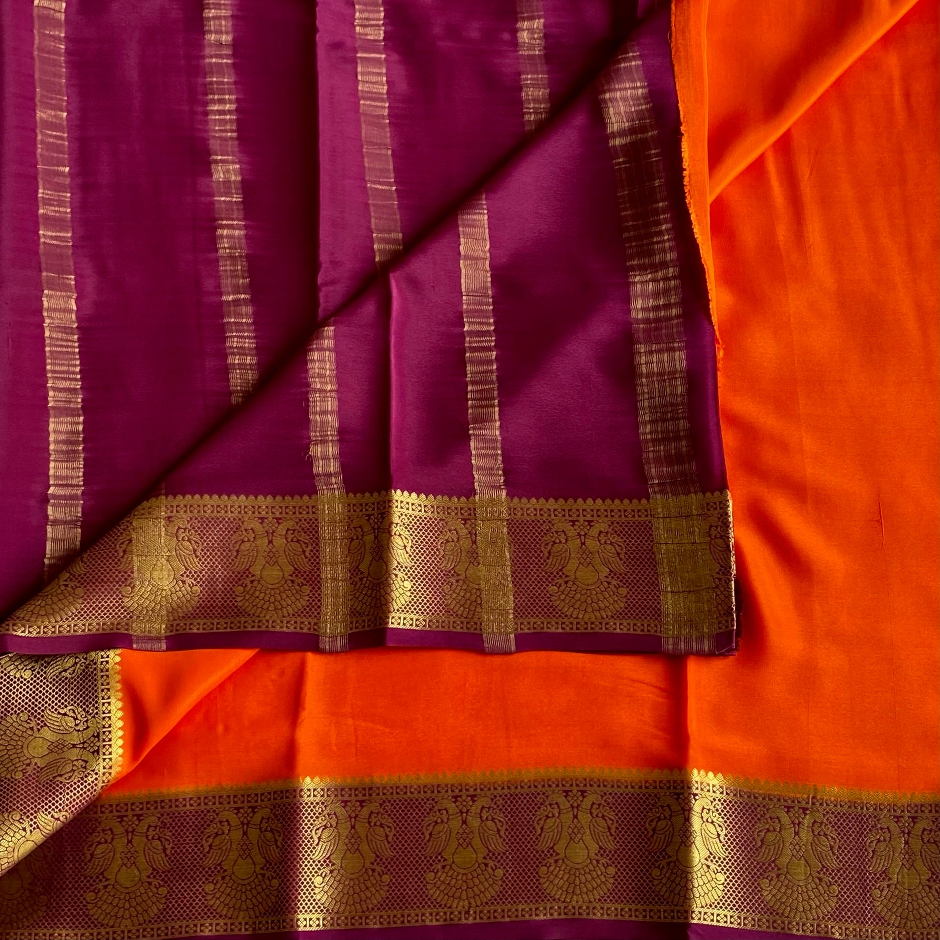 Vibrant Orange Saree Gold Peacock Border Deep Wine Purple Pallu Traditional
