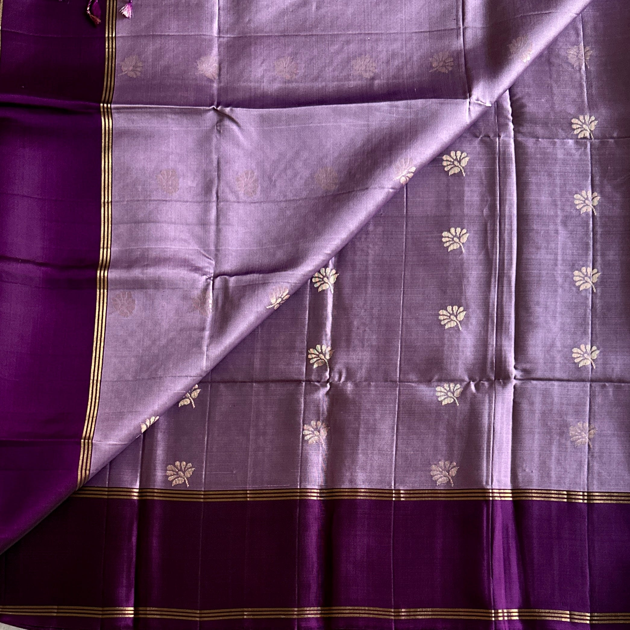 Purple silk saree gold zari floral border diamond pallu tassels